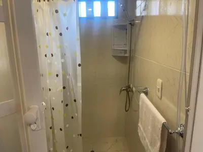 a bathroom with a shower with a shower curtain at 15 Acogedor dpto de un ambiente en miraflores in Lima