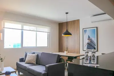 a living room with a couch and a table at Black by Wynwood House in Lima