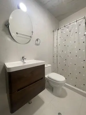 a bathroom with a sink and a toilet and a mirror at 18 Departamento en la mejor zona de Miraflores in Lima