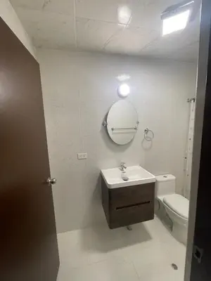 a bathroom with a sink and a toilet and a mirror at 18 Departamento en la mejor zona de Miraflores in Lima