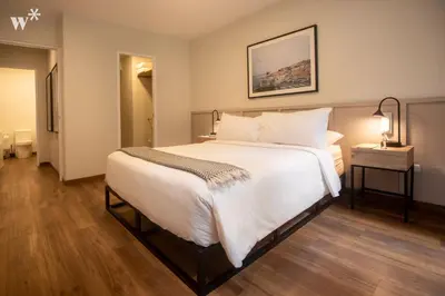 a bedroom with a large white bed in a room at Alcanfores 1262 by Wynwood House in Lima