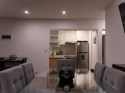 a dining room with a glass table with a camera on it at Apartment in Center of Miraflores in Lima