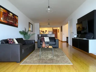 a living room with a couch and a table at Book in Miraflores - Lima in Lima