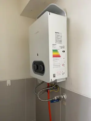 a water heater in the corner of a room at Book in Miraflores - Lima in Lima