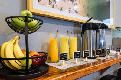 a counter with a bunch of fruit and juice at TARATA BOUTIQUE HOTEL in Lima
