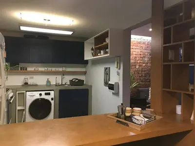 a kitchen with a counter top and a dishwasher at Departamento Cool & Comodo, San Isidro in Lima