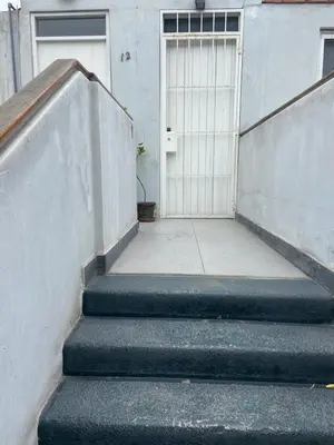 a set of stairs with a door in a building at Departamento Cool & Comodo, San Isidro in Lima