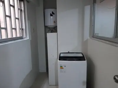 a room with a refrigerator in the corner of a room at BONITO DEPARTAMENTO EN MIRAFLORES in Lima