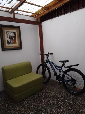 a bike and a chair in a room at BONITO DEPARTAMENTO EN MIRAFLORES in Lima