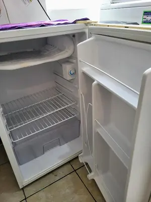 an open refrigerator with its door open and its shelves at Private Cozy room with batroom in Miraflores in Lima