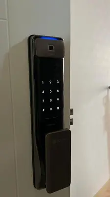 a black cell phone is attached to a wall at APARTAMENTO KELVIN - Edificio ON APARTMENTS in Lima