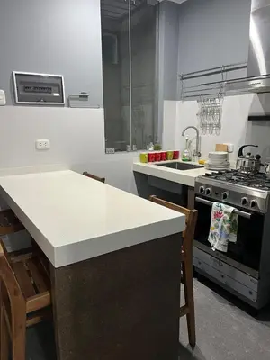 a kitchen with a stove and a counter top at MH Apartments Ica 3 in Ica