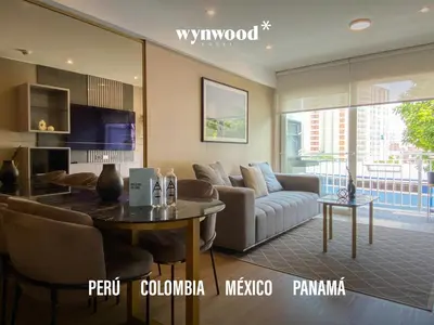 a living room with a couch and a table at Morada by Wynwood House in Lima