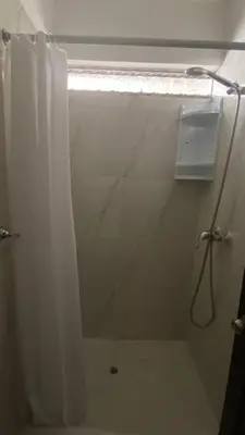 a bathroom with a shower with a shower curtain at Departamentos Alcanfores 775 Miraflores in Lima