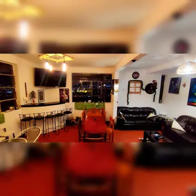 a living room with a couch and a table at Antis Apartment in Cusco