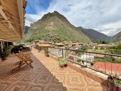 a balcony with a view of a mountain at Hostal EL VIAJERO en Ollantaytambo in Ollantaytambo