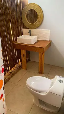 a bathroom with a white toilet and a sink at AMAY in Asia