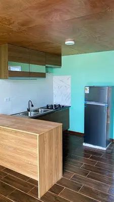 a kitchen with a sink and a refrigerator at AMAY in Asia