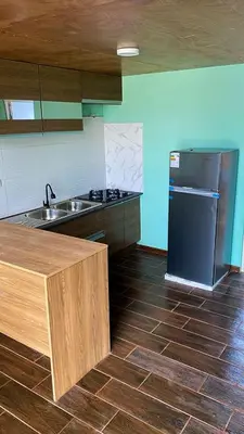 a kitchen with a sink and a refrigerator at AMAY in Asia