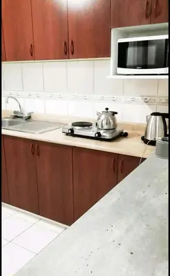 a kitchen with a tea pot on a counter at Pacific Spot San Miguel in Lima