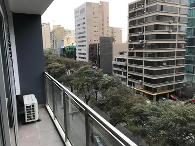 a view of a city from a balcony of a building at Hermoso apartamento con piscina Miraflores- Canvas in Lima