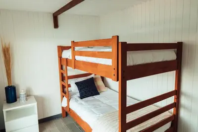 a couple of bunk beds in a room at Atenas Hotel Boutique in Paracas