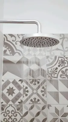 a chandelier hanging over a glass table in a room at Depa acogedor en el corazón de la ciudad in Lima