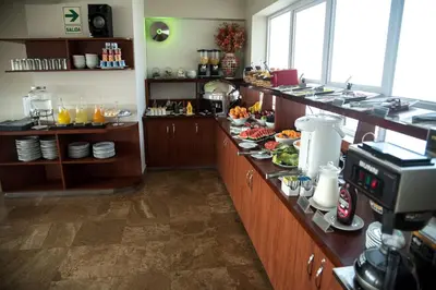 a kitchen with a counter with food on it at Hotel Andesmar in Lima