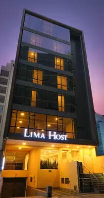 a building with a lit up sign on it at LIMA HOST in Lima