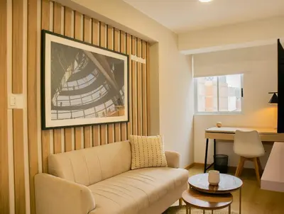 a living room with a couch and a table at Cantuarias 355 by Wynwood House in Lima