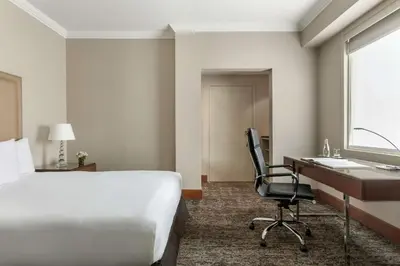 a hotel room with a bed and a desk and a computer at DoubleTree by Hilton Lima Miraflores El Pardo in Lima