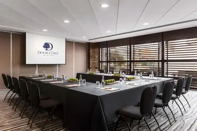 a conference room with a long table and chairs at DoubleTree by Hilton Lima Miraflores El Pardo in Lima