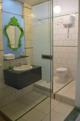 a bathroom with a sink and a toilet at Collacocha B&B in Lima