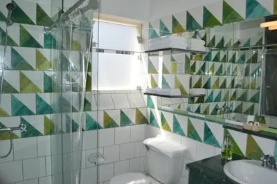 a bathroom with a toilet and a sink at Collacocha B&B in Lima