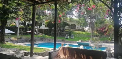 a view of a swimming pool from a yard at Darenas Hacienda in Aucallama