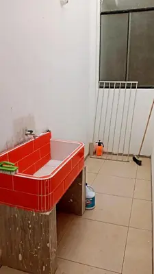 a red bath tub sitting in a room at CASITA PARA FIN DE SEMANA in Rancho Cesar