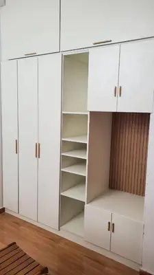 a white cabinet with white doors and shelves at CASITA PARA FIN DE SEMANA in Rancho Cesar