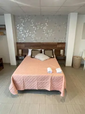 a bedroom with a bed with two towels on it at Huancayo Suite 3, cómodo MiniDpto cama matrimonial in Huancayo