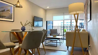 a dining room and living room with a table and chairs at Actual by Wynwood House in Lima