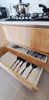 a kitchen drawer filled with lots of cooking utensils at VK Loft - Apartamento en Miraflores in Lima