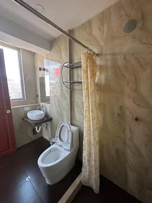 a bathroom with a toilet and a sink at Hotel Inka Palace Huayna Ccapac Cusco in Cusco