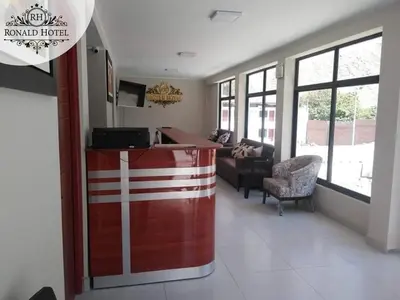 a kitchen and living room with a bar in a room at RONALD HOTEL in Churín