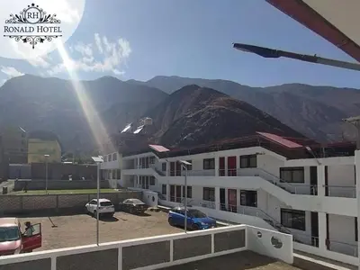 a view of a building with mountains in the background at RONALD HOTEL in Churín