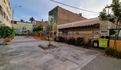 a building with bikes parked outside of it at Paiva in Lima