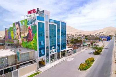 a view of a building with a desert in the background at Hotel Savilayo in Ica