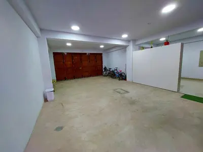 a garage with two motorcycles parked in it at Kasanty House in Paracas