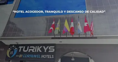 a group of flags on top of a building at Hotel Turikys Churin in Churín