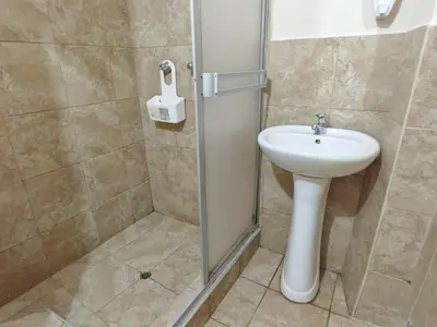 a bathroom with a sink and a shower at Centro Cusco Inti in Cusco