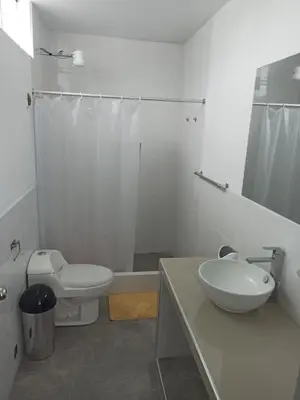 a bathroom with a sink and a toilet and a shower at Hermosa y espléndida casa en Oxapampa in Oxapampa