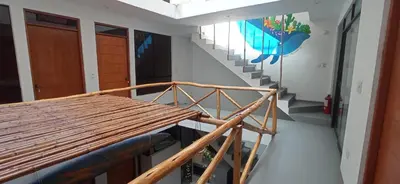 a view of a staircase in a room at Bravo Hostels: Surf House in Punta Hermosa